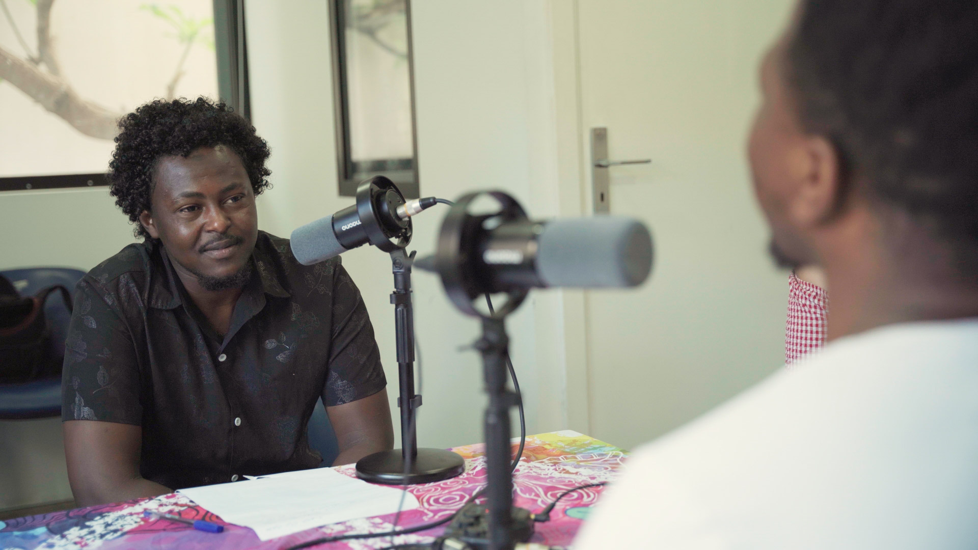 Podcast studio — participants at microphones